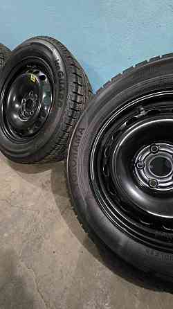 Продам Шины Yokohama 215 60 16 с дисками 5×112 в сборе. Стояли на vw passat Донецк