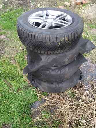 Продам литые диски с зимней резиной на автомобиль Пежо Донецк