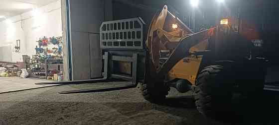 Услуги Фронтального погрузчика и самосвала и вилы палетные Кировское