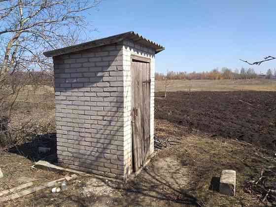 Продам землю с недостроенным домом. Докучаевск