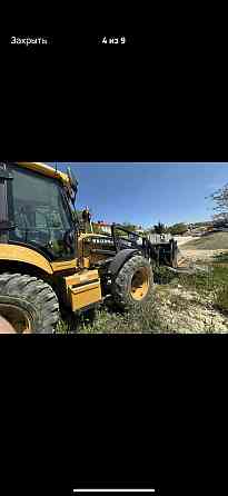 Экскаватор-погрузчик в аренду Донецк