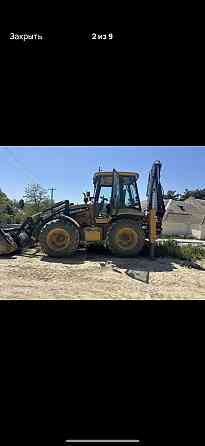 Экскаватор-погрузчик в аренду Донецк
