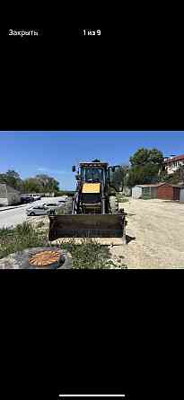 Экскаватор-погрузчик в аренду Донецк