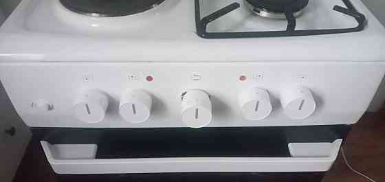 Продам комбинированную электроплиту Hansa (2 конфорки газовые) Донецк