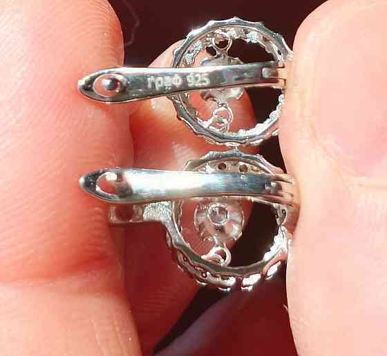 Серебряные серьги с танцующим фианитом Донецк