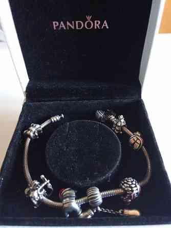 Продам серебряный оригинальный браслет Pandora с шармами. Донецк