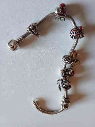 Продам серебряный оригинальный браслет Pandora с шармами. Донецк