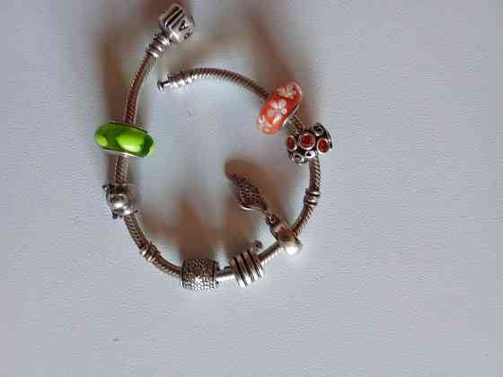 Продам серебряный оригинальный браслет Пандора с шармами. Донецк