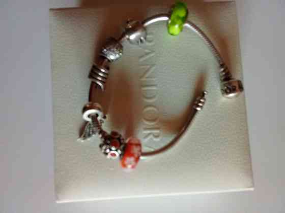 Продам серебряный оригинальный браслет Пандора с шармами. Донецк