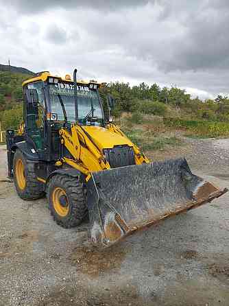 Услуги экскаватора-погрузчика Мариуполь