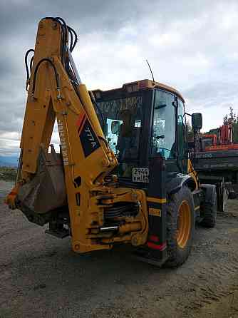 Услуги экскаватора-погрузчика Мариуполь