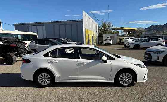 Тойота Королла год 2022 Цвет кузова белый жемчуг бензин 1,8 передний привод Донецк