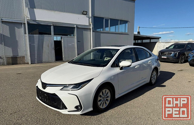 Тойота Королла год 2022 Цвет кузова белый жемчуг бензин 1,8 передний привод Донецк - изображение 2