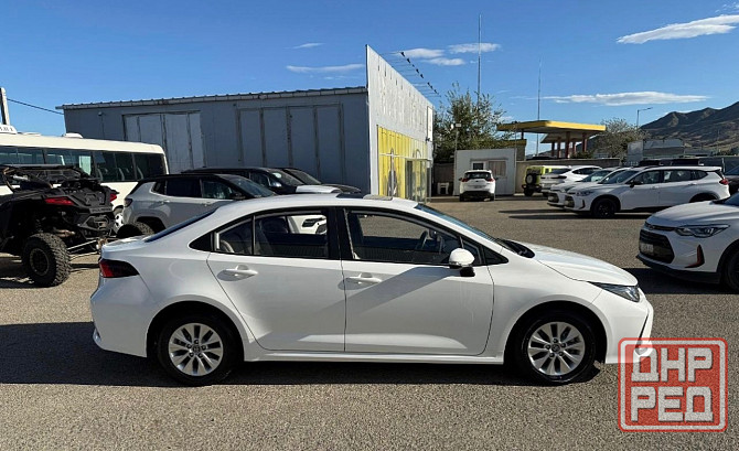 Тойота Королла год 2022 Цвет кузова белый жемчуг бензин 1,8 передний привод Донецк - изображение 4