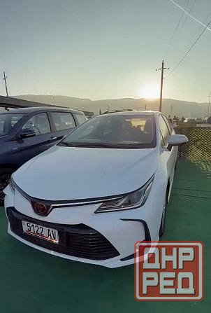 Тойота Королла год 2022 Цвет кузова белый жемчуг бензин 1,8 передний привод Донецк - изображение 1