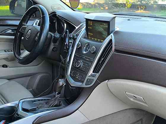Продам очень красивый автомобиль , самый надёжный и недорогой в обслуживании Cadillac SRX 2012 года Енакиево
