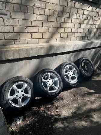 Продам комплект из 4 колес: литые диски R15 с летней резиной Geely Emgrand EC7. Донецк