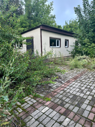 Коммерческое помещение с участком земли 8,5 сотки в Ясиноватой Ясиноватая