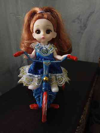 Шарнирная кукла на велосипеде плюс подарок. Донецк