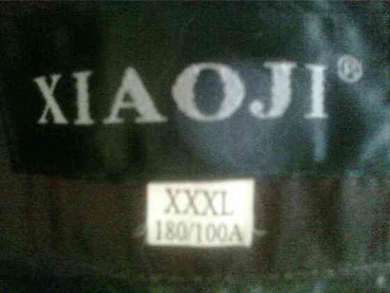 Куртка осень-зима с капюшоном тёплая,удлинённая с цветными паетками новая,р-р50-52 Донецк