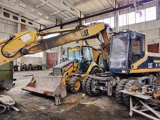 Экскаватор погрузчик CAT 428 E с гидромолотом и 3 ковшами Запорожье