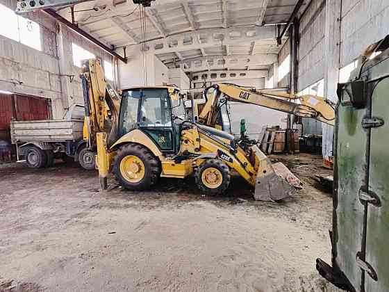 Экскаватор погрузчик CAT 428 E с гидромолотом и 3 ковшами Запорожье